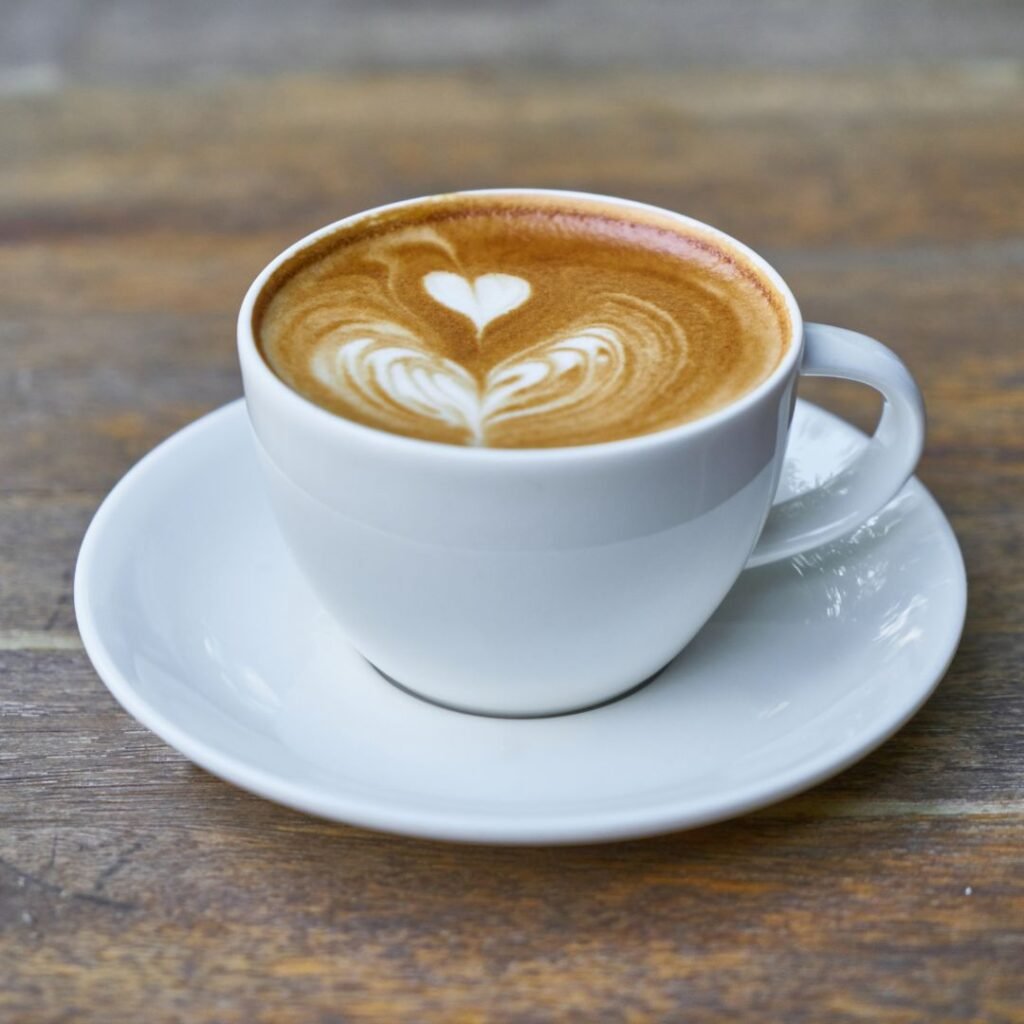 coffee in white cup on wooden table