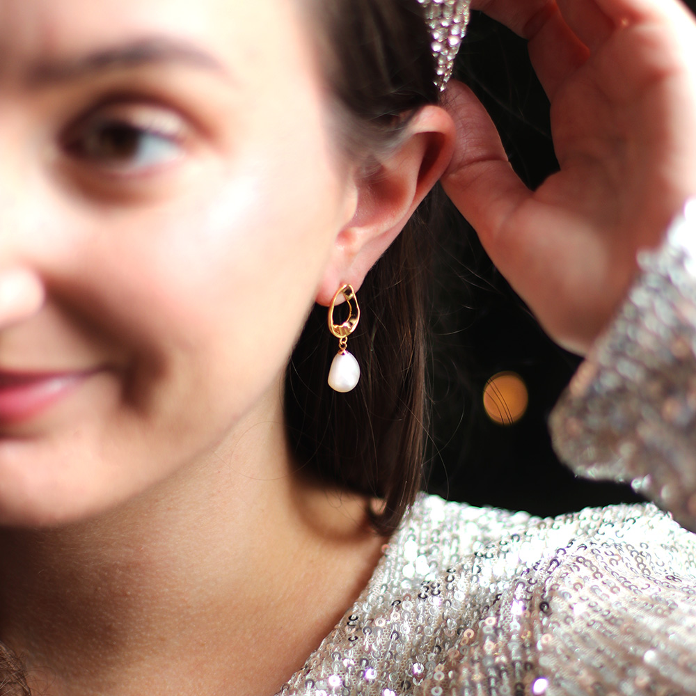 model wearing baroque pearl drop gold plated earrings