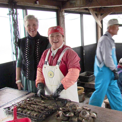 Angie Taylor at a pearl farm with pearl farmers