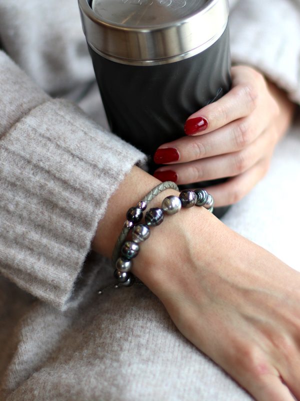 model wearing Tahitian pearl bracelets together