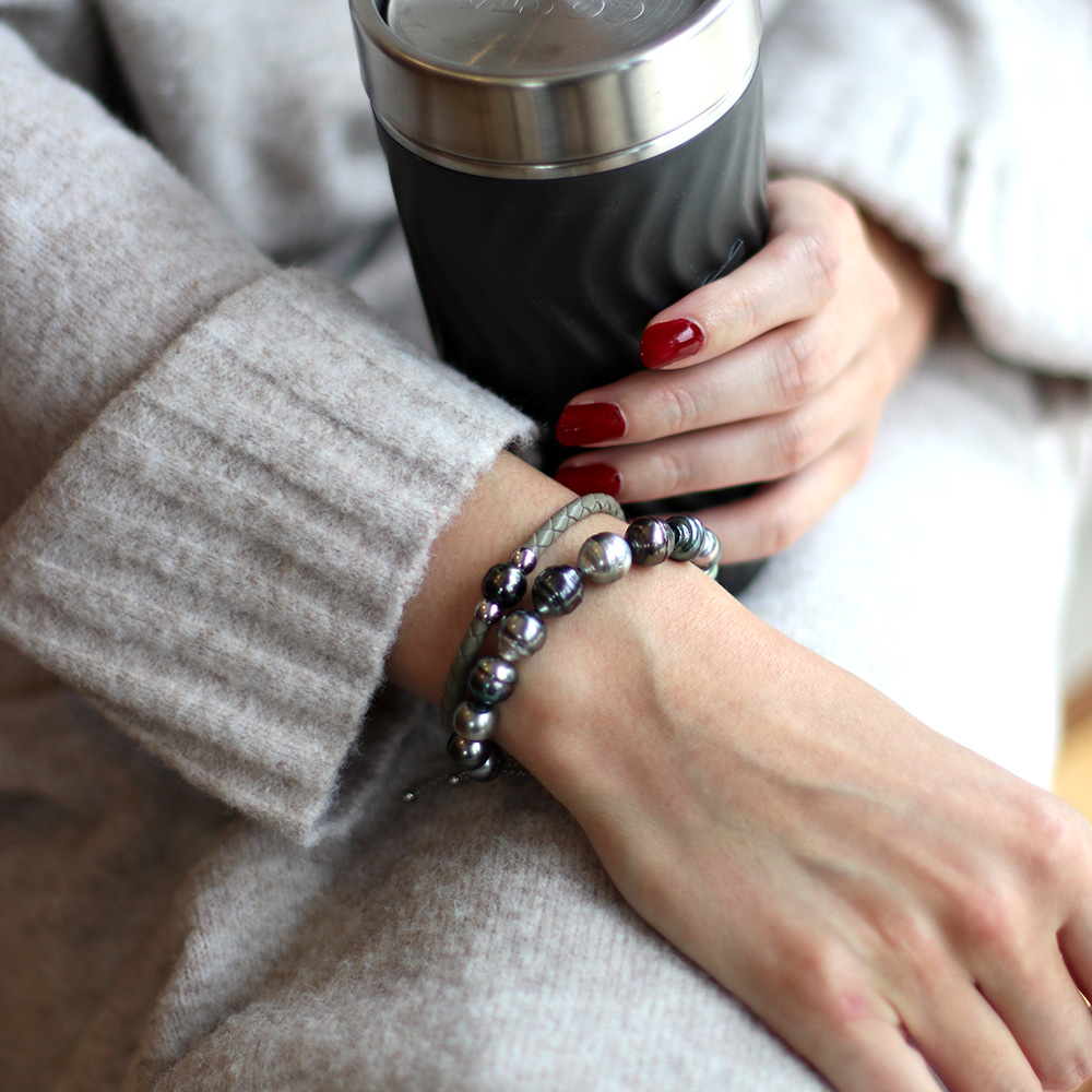 model wearing Tahitian pearl bracelets together